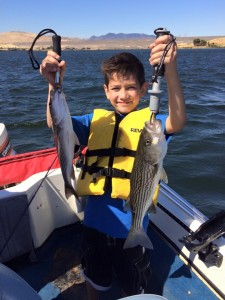 Christopher with two stripers           